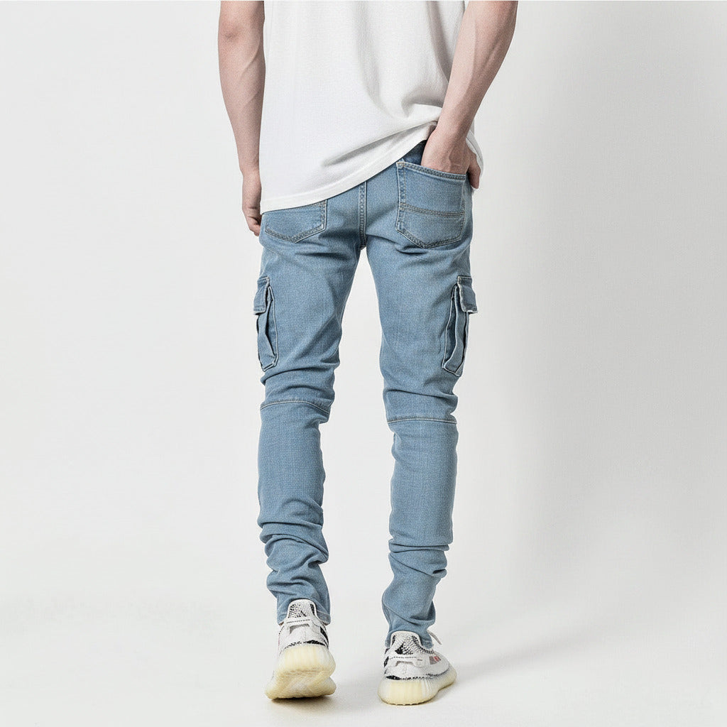 Person wearing light blue cargo pants on a plain background