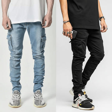 Two people wearing cargo pants and sneakers on a plain background